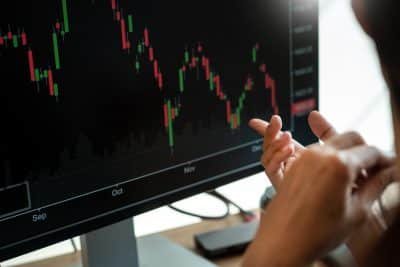 monitor with candlestick chart of SPX